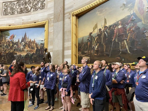 The students gaze on the Rotunda of the United States Capitol as they receive a tour and hear about the rich history of the building.